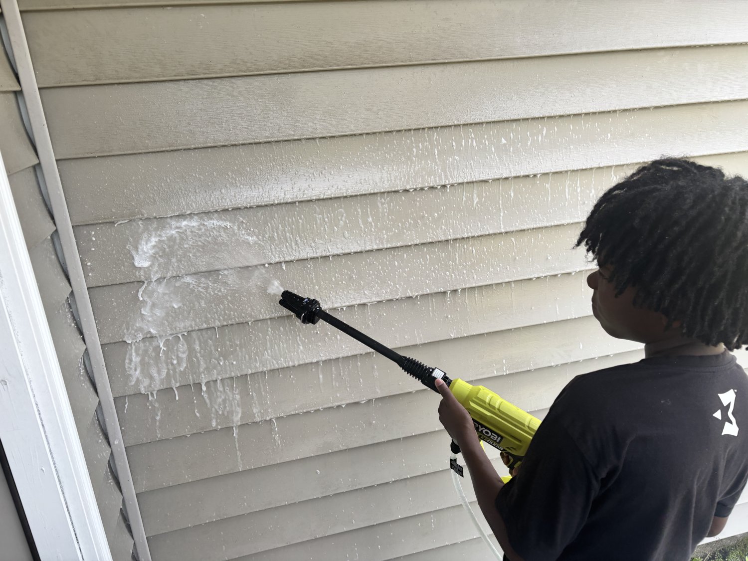 Pressure washing a home's siding