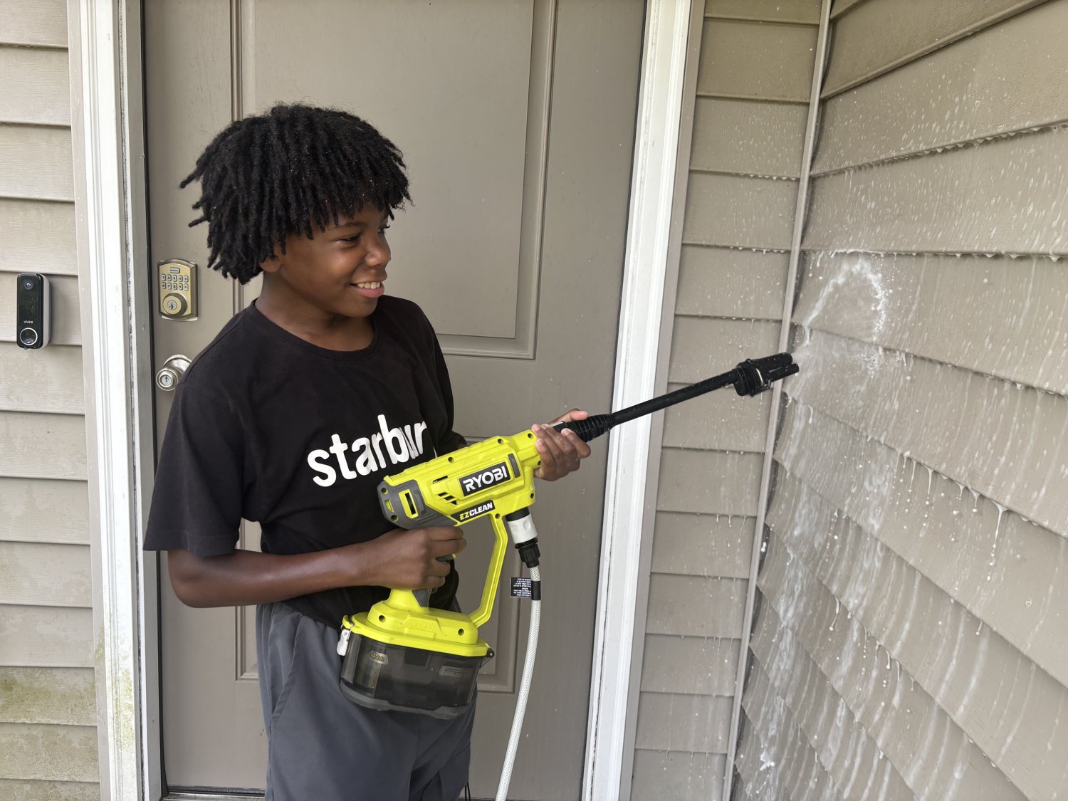 OSC Services pressure washing a home's siding in Everett's Creek